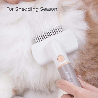 3-IN-1 Pet Grooming Kit detangling rake head on pet fur for shedding season.